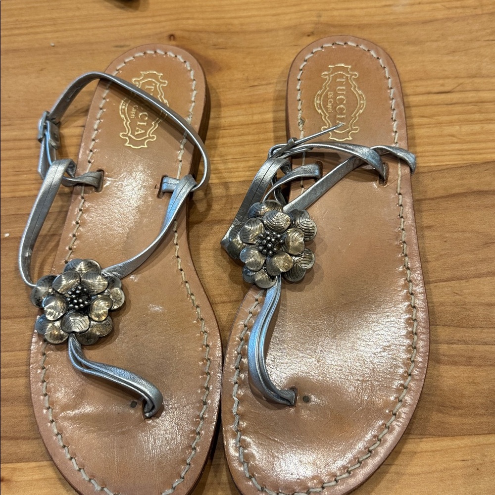 Tucci of Capri Silver Sandals with floral embellishment.